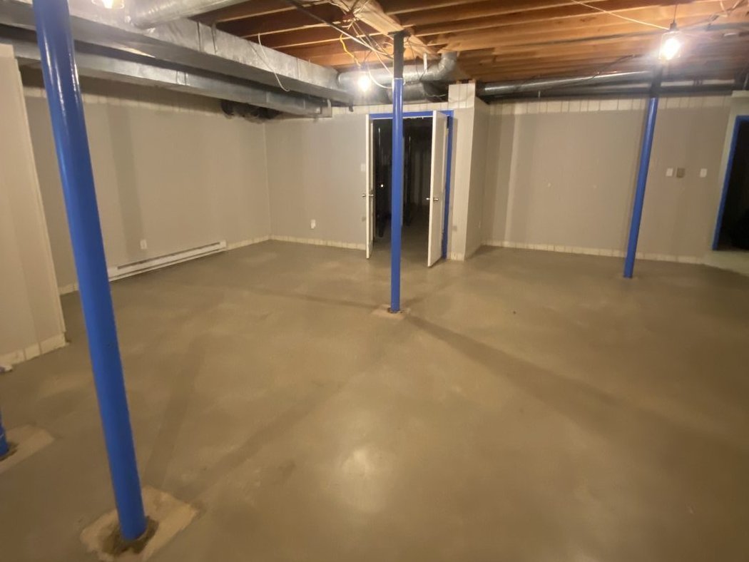 After basement cleanout in Charlotte NC — same basement completely cleared and empty
