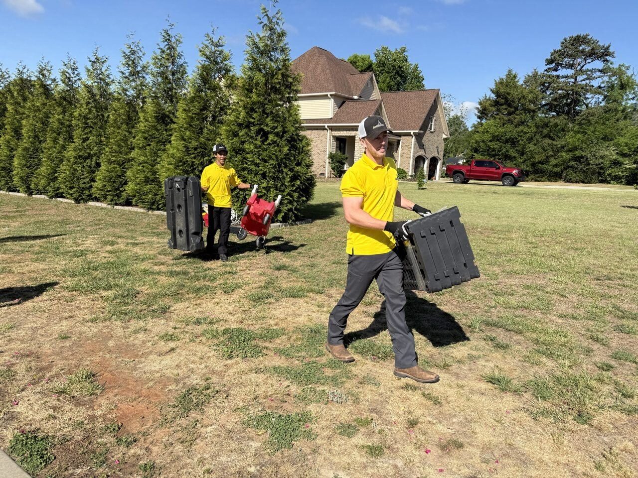 Crew carrying yard debris to the truck