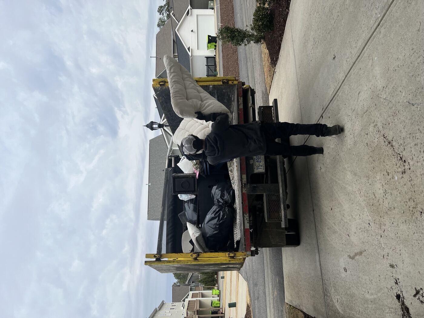 Deck debris being removed by Junk Doctors crew